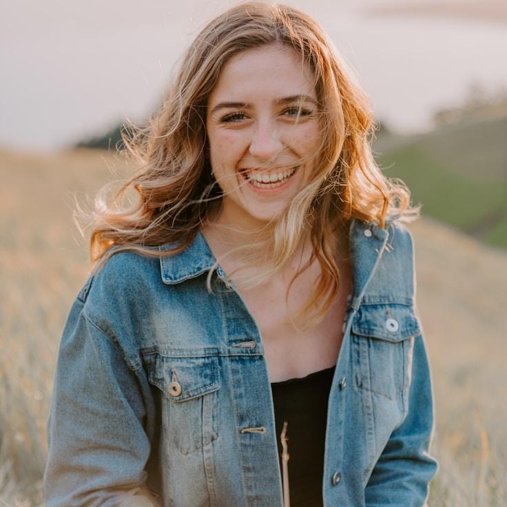 Aria Kapoor, Lead Design Curator at PlainMarketTune, reviewing corporate floral arrangements